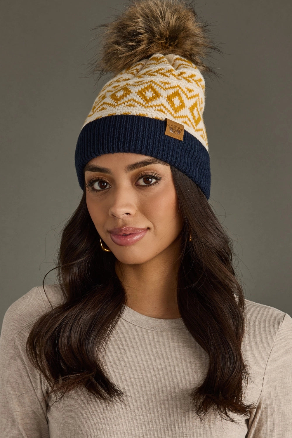 The Golden Summit Pom Beanie