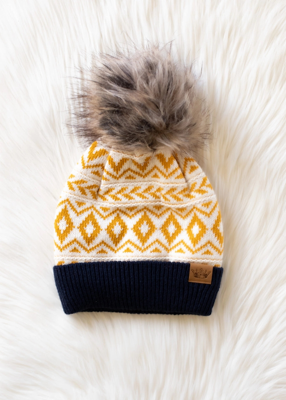 The Golden Summit Pom Beanie